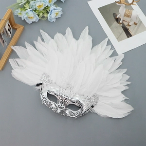 Elegant Venetian silver mask with white feathers and ornate filigree patterns