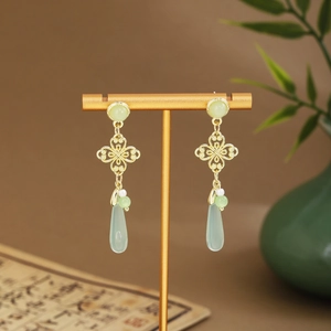 Traditional Chinese style long tassel earrings with green fan-shaped jade and gold finish