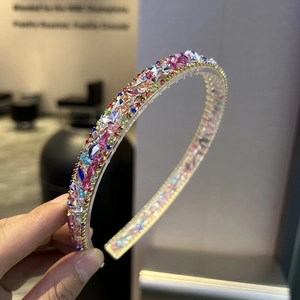 Detailed view of colorful rhinestones on a baroque headband with clear crystal accents