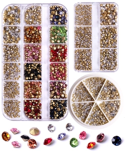 Detailed set of multi-colored pointed-back nail art rhinestones in storage containers