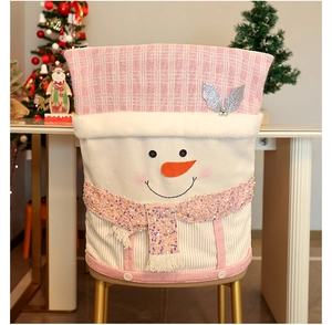 Close-up of pink snowman chair cover with sequin scarf and plush knit fabric details