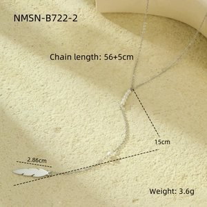 Macro detail of leaf pendant necklace with pearls and technical size specifications