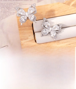 Detail of butterfly stud earring with teardrop zircon and titanium steel screw back