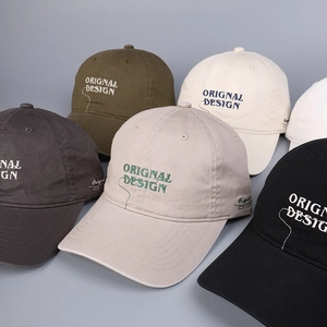 Close-up of cotton baseball caps showing assorted colors and precise embroidery detail