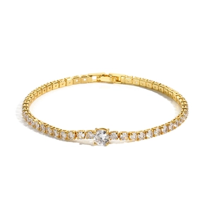 Detailed close-up of a gold tennis bracelet featuring brilliant round cubic zirconia stones