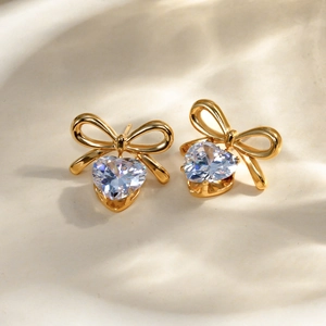 18k gold plated stainless steel bow earrings with heart-shaped white zircon pendants