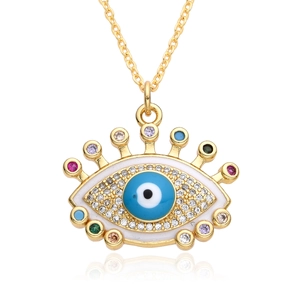 Golden necklace featuring a vibrant evil eye pendant with colorful zircon stones on white base