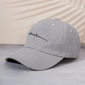 Gray cotton baseball cap with black cursive Freedom embroidery and a minimalist outdoor design