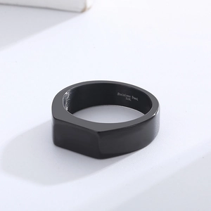 Macro shot of 316L stainless steel minimalist black matte flat band ring for men