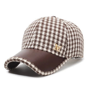 Houndstooth pattern baseball cap with brown leather brim and gold M metal detail