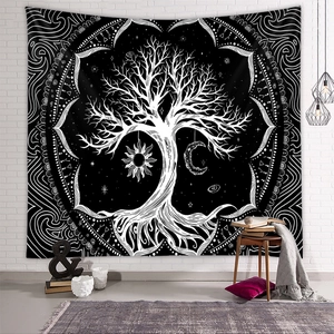 Detail of tree of life tapestry with sun and moon symbols on a white brick wall