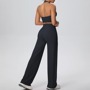 Rear view of black halter yoga set with backless sports bra and wide-leg joggers
