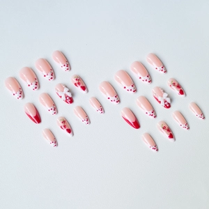 Detailed set of French style cherry press-on nails with 3D bows and pearls