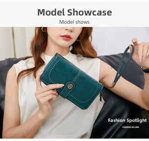 Detail of dark green RFID wallet showing vintage leather texture and stitch patterns