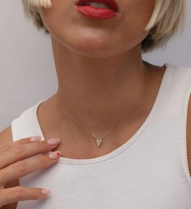 Close-up of S925 sterling silver heart pendant necklace with diamonds on collarbone