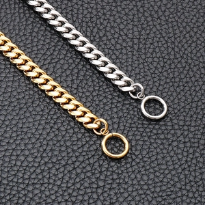 Detail of silver and gold stainless steel Cuban link bracelets with OT toggles on leather