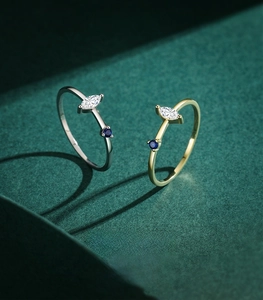 Macro shot of 925 sterling silver rings with marquise zircon and blue stone inlay