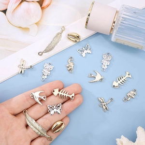 Assorted vintage alloy charms in gold and silver finish featuring animal and nature motifs