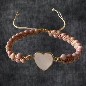 Detail of pink imperial stone heart pendant and hand-woven beaded adjustable bracelet