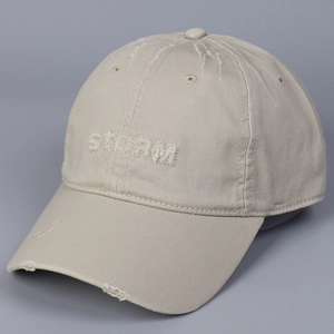 Close-up of distressed cotton baseball cap with 3D STEAM embroidery and worn edges