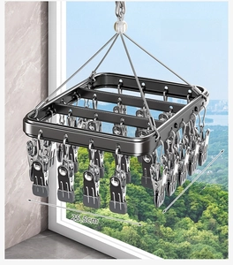 Black aluminum sock drying rack with 26 metal clips for laundry balcony use