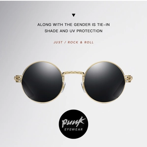 Detail of gold metal frame with retro texture on steampunk round polarized sunglasses