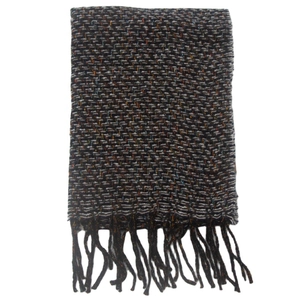 Detailed view of knit scarf with black and white multi-color threads and fringe edges