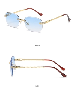 Detail of rimless rectangle sunglasses with blue gradient lenses and gold metal trim