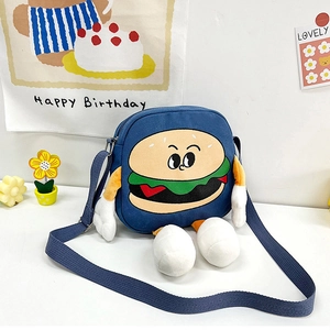 Detail view of the zipper closure and adjustable shoulder strap on the canvas hamburger bag