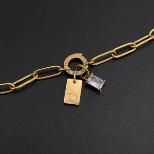 Gold stainless steel paperclip necklace with D letter tag and emerald cut zircon