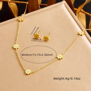 Golden stainless steel daisy jewelry set including flower necklace and stud earrings
