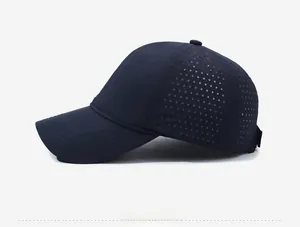 Detail view of navy blue baseball cap showing laser-cut side mesh for breathability