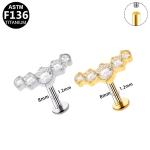 Detailed view of G23 titanium labret studs with internal threading and zircon stones