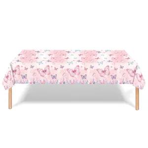 Detail of pink disposable tablecloth with colorful butterfly and floral border patterns