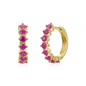Exquisite gold huggie earrings with sparkling pink cubic zirconia in a minimalist style