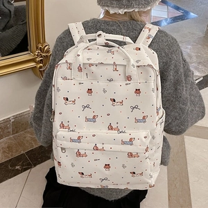 Student backpack with cartoon dachshund and bow print in cream canvas with large capacity