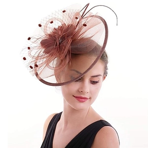 Elegant brown fascinator hat with vintage mesh and feathers for bridal or gala events