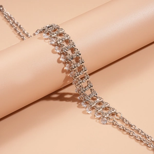 Elegant silver choker necklace with shimmering rhinestones and cascading water-drop pendants