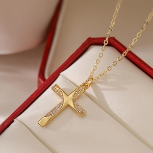 Elegant 18K gold plated cross necklace with zircon stones in a red jewelry box