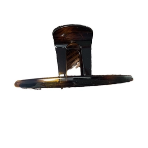 Brown tortoiseshell butterfly hair claw clip for women on a clean white background