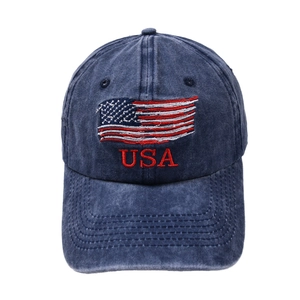 Close-up of USA embroidery and American flag patch on washed navy denim baseball cap