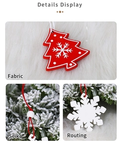 Detail of wooden Christmas ornaments featuring red tree and white snowflake motifs