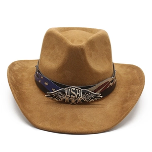 Close-up of brown suede cowboy hat with American flag band and metal USA ornament