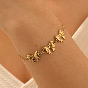 Bracelet chaîne élégant doré avec nœuds en acier inoxydable poli pour usage quotidien