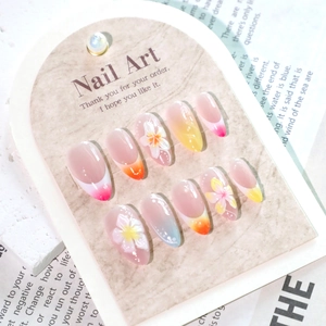 3D floral press-on nails with tropical hibiscus design and colorful French sunset gradient