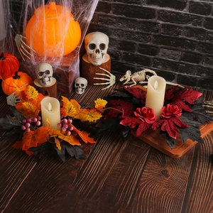 Halloween LED candle ring set with maple leaves and roses on a rustic wooden table