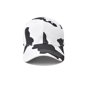 Classic cotton baseball cap with stylish black and white cow print and curved visor