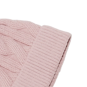 Detailed view of pink cable knit beanie featuring soft texture and ribbed cuff design