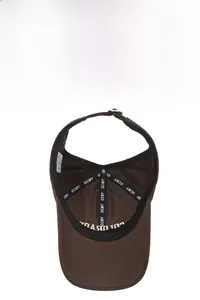 Detail of brown sun visor showing breathable sweatband and precise stitching workmanship