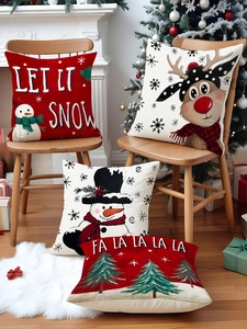 Detailed view of four Christmas linen pillowcases with reindeer and snowman prints